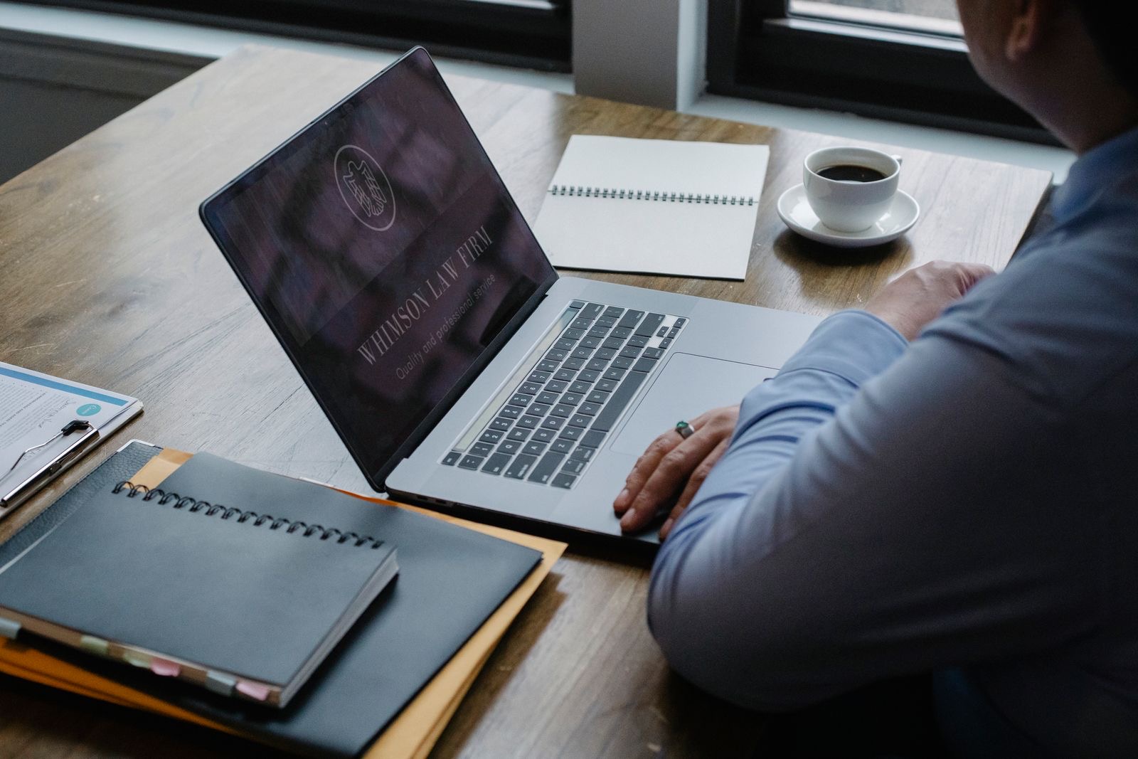 Payroll documents beside a laptop in an office, where the tax-free allowance is applied each month