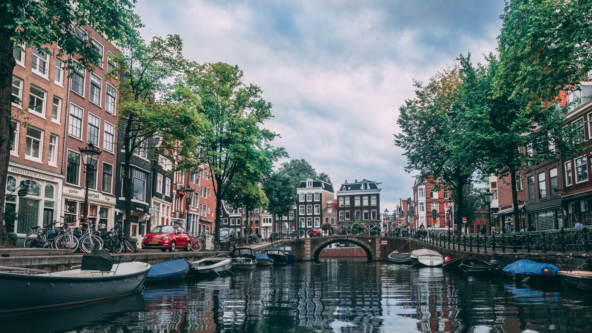 Canal-side office buildings on an Amsterdam business street, where a Dutch company can have its seat.