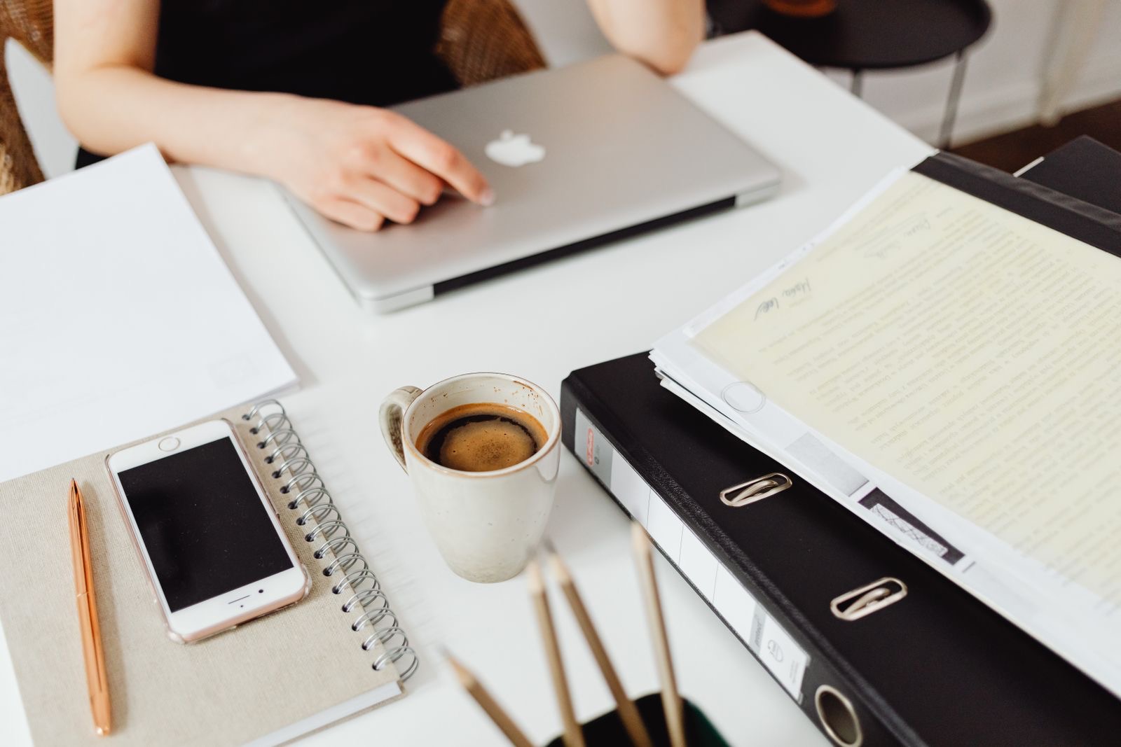 Binders, a laptop and a printed group chart, the papers a ruling request in the Netherlands is built from.