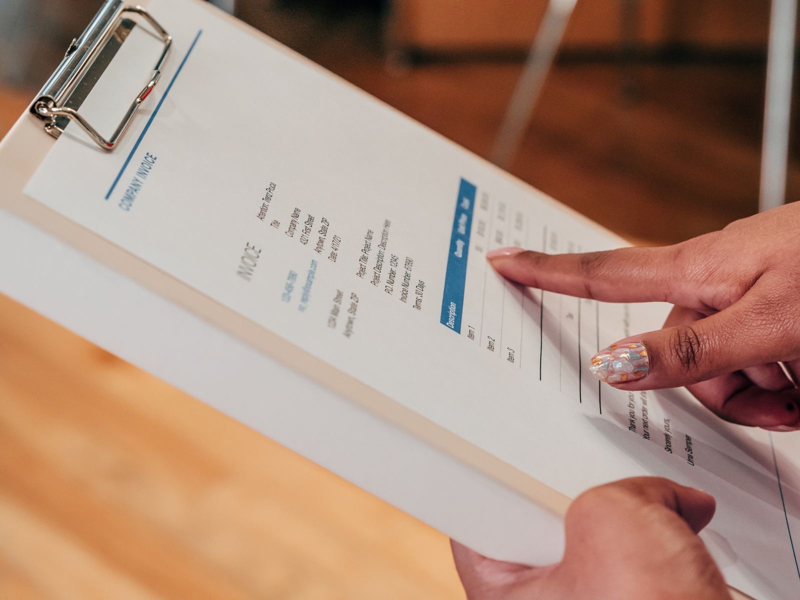 Close-up of a printed invoice with a company letterhead on a desk